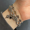 Spike cross heart piercing bracelet
