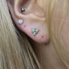 Green symbol piercing